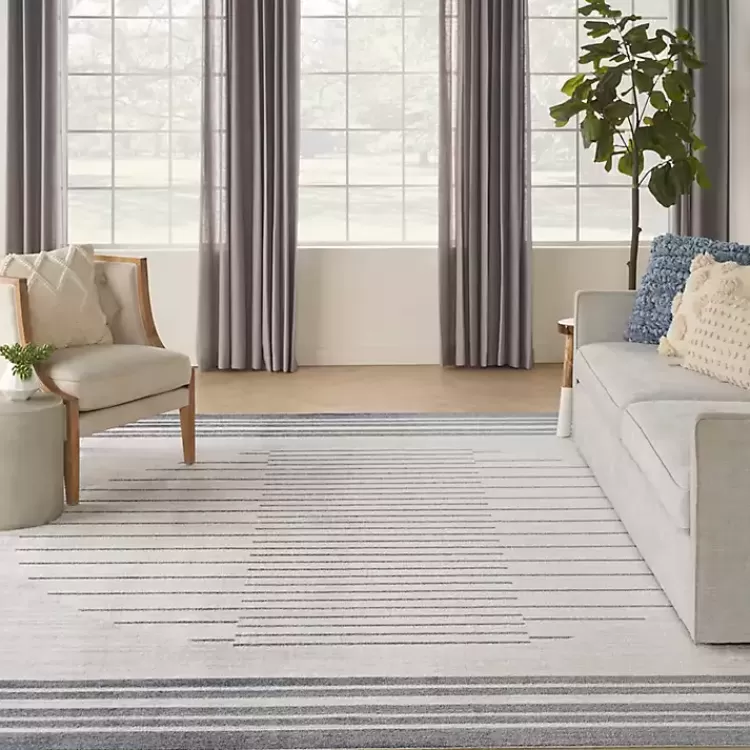 blue_and_ivory_striped_moon_area_rug_x_7.webp Blue and Ivory Striped Moon Area Rug, 9x12>Kirklands Home Sale
