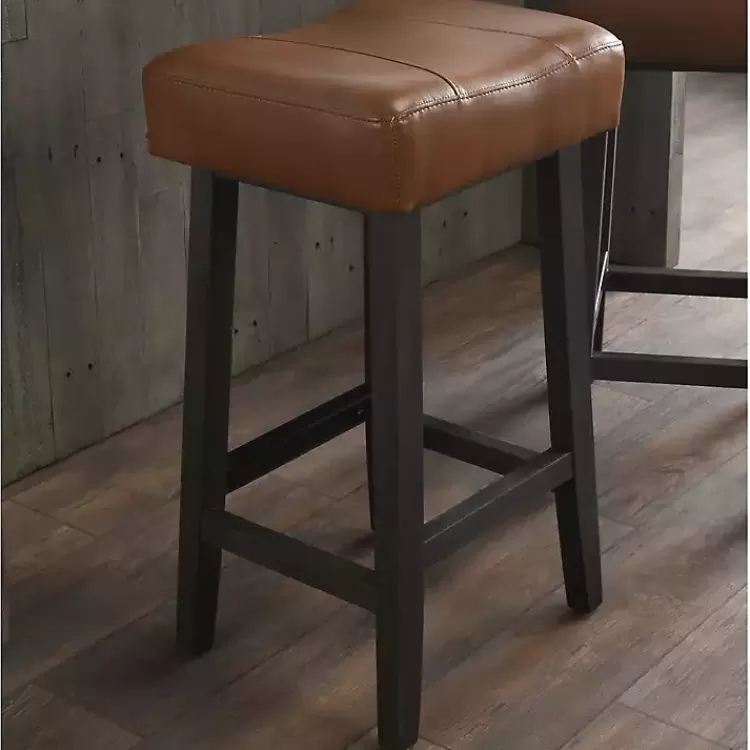 caramel_wood_and_faux_leather_backless_stool_3.webp Caramel Wood and Faux Leather Backless Stool>Kirklands Home Outlet