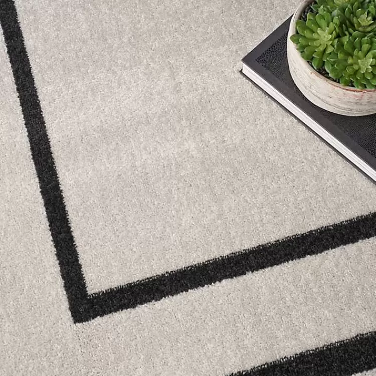 ivory_bordered_indooroutdoor_area_rug_x_7-1.webp Bordered Indoor/Outdoor Area Rug, 8x10>Kirklands Home Best Sale