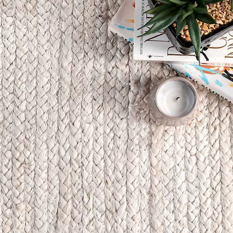 ivory_hand_woven_rigo_jute_area_rug_x_3.webp Hand Woven Rigo Jute Area Rug, 9x12>Kirklands Home Store